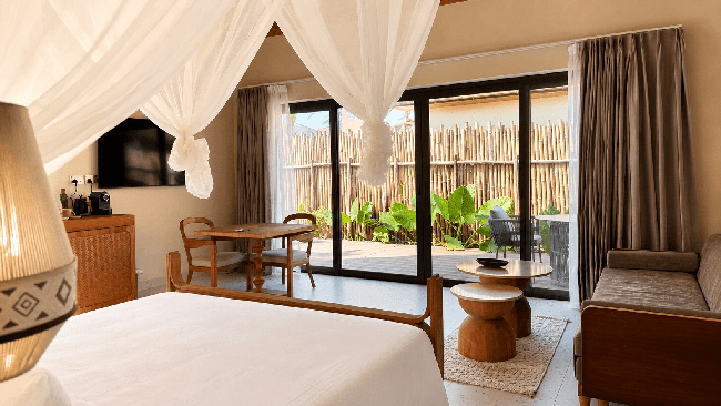 Garden Villa bedroom and private terrace at ENVI Paje Zanzibar