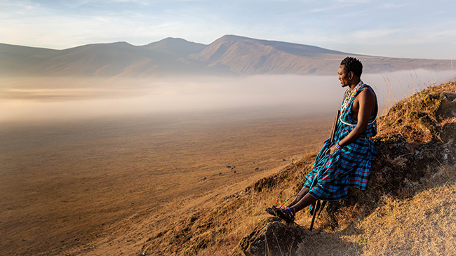 A Maasai figure overlooking the Ngorongoro Conservation Area